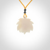 This is a hand carved lotus flower pendant. It is made from bone. This is a medium sized necklace and is a very unique pendant and is a wonderful necklace to wear. Hand carved bone lotus flower pendant with adjustable cord.